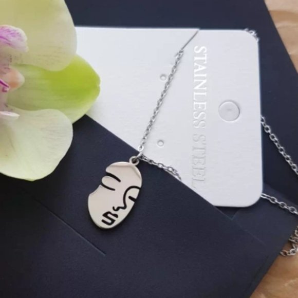 boutique Jewelry - Silver stainless steel abstract face imprint necklace